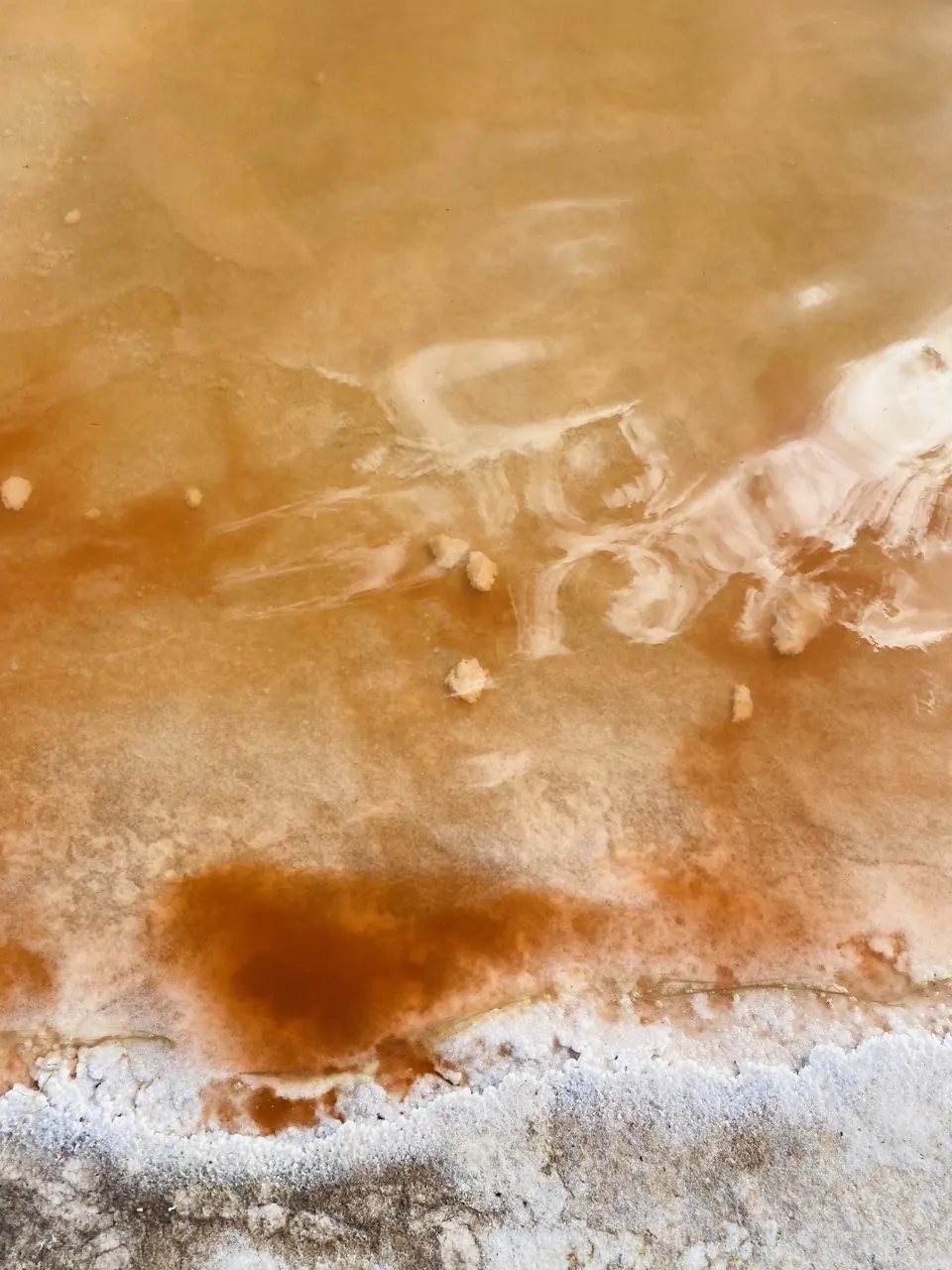 Aerial view of golden and white salt flats near Mildura